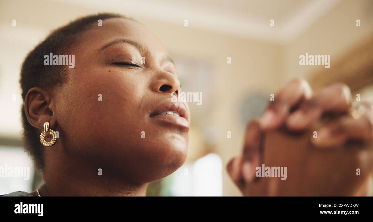 Praying, religion and black woman in home for worship, praise and hope …