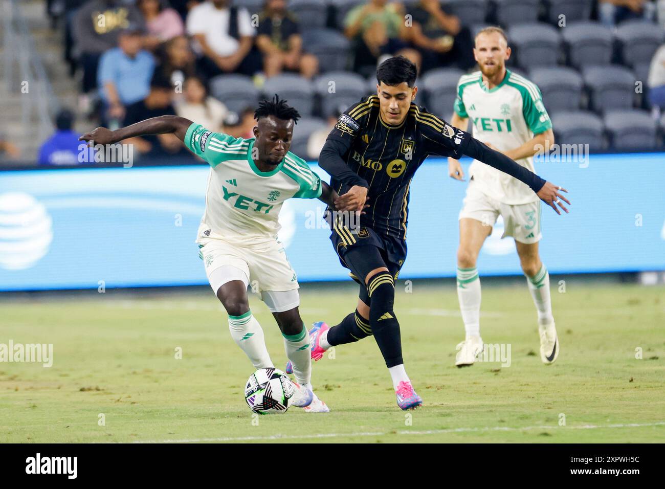 Los Angeles, United States. 07th Aug, 2024. Austin FC's Osman Bukari (L) and Los Angeles FC's Omar Campos (L) vie for the ball during a Leagues Cup match at BMO Stadium. Los Angeles FC won against Austin FC 2-0 Credit: SOPA Images Limited/Alamy Live News Stock Photo