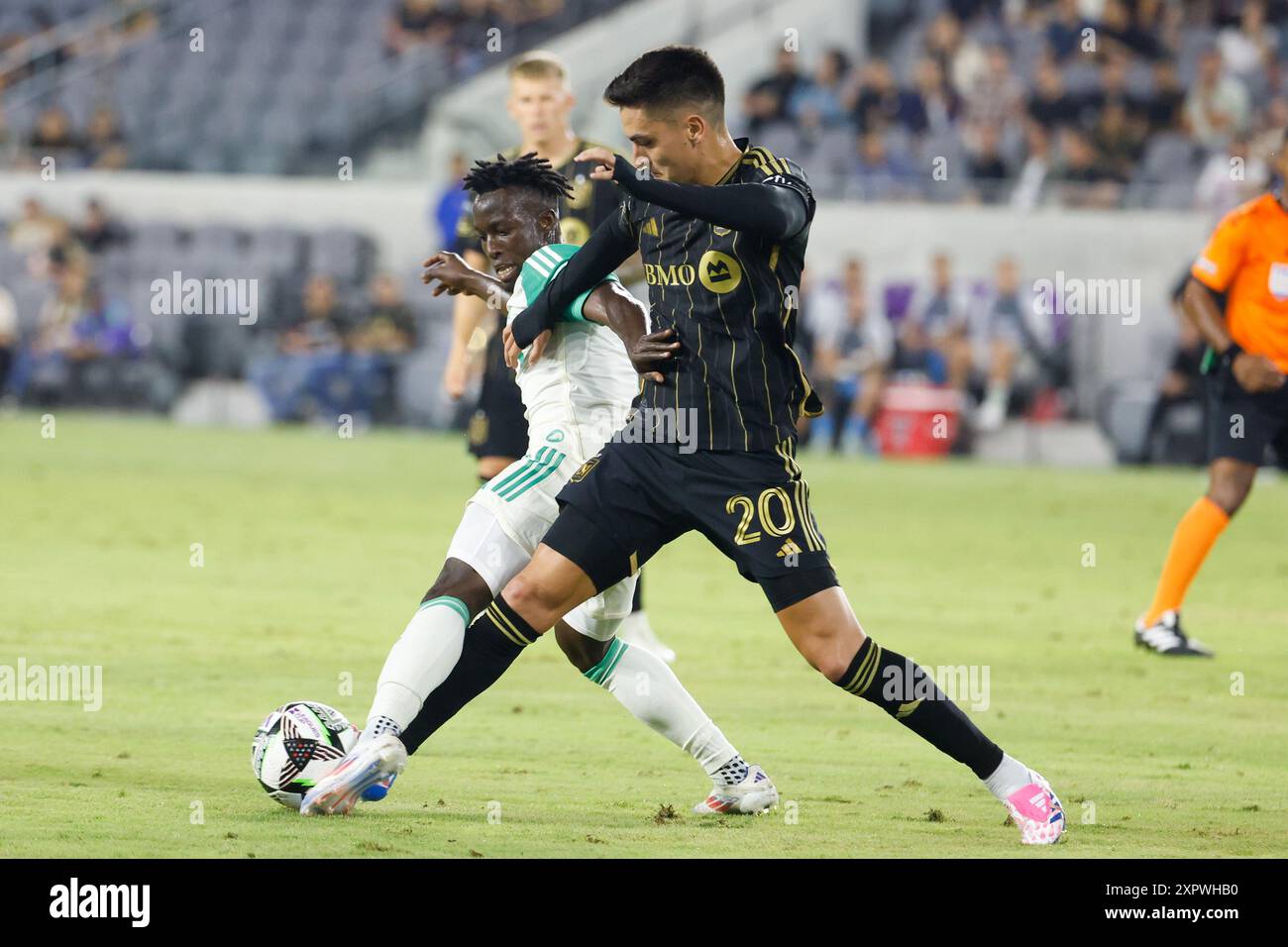 Los Angeles, United States. 07th Aug, 2024. Austin FC's Osman Bukari (L) and Los Angeles FC's Eduard Atuesta (R) vie for the ball during a Leagues Cup match at BMO Stadium. Los Angeles FC won against Austin FC 2-0 (Photo by Ringo Chiu/SOPA Images/Sipa USA) Credit: Sipa USA/Alamy Live News Stock Photo