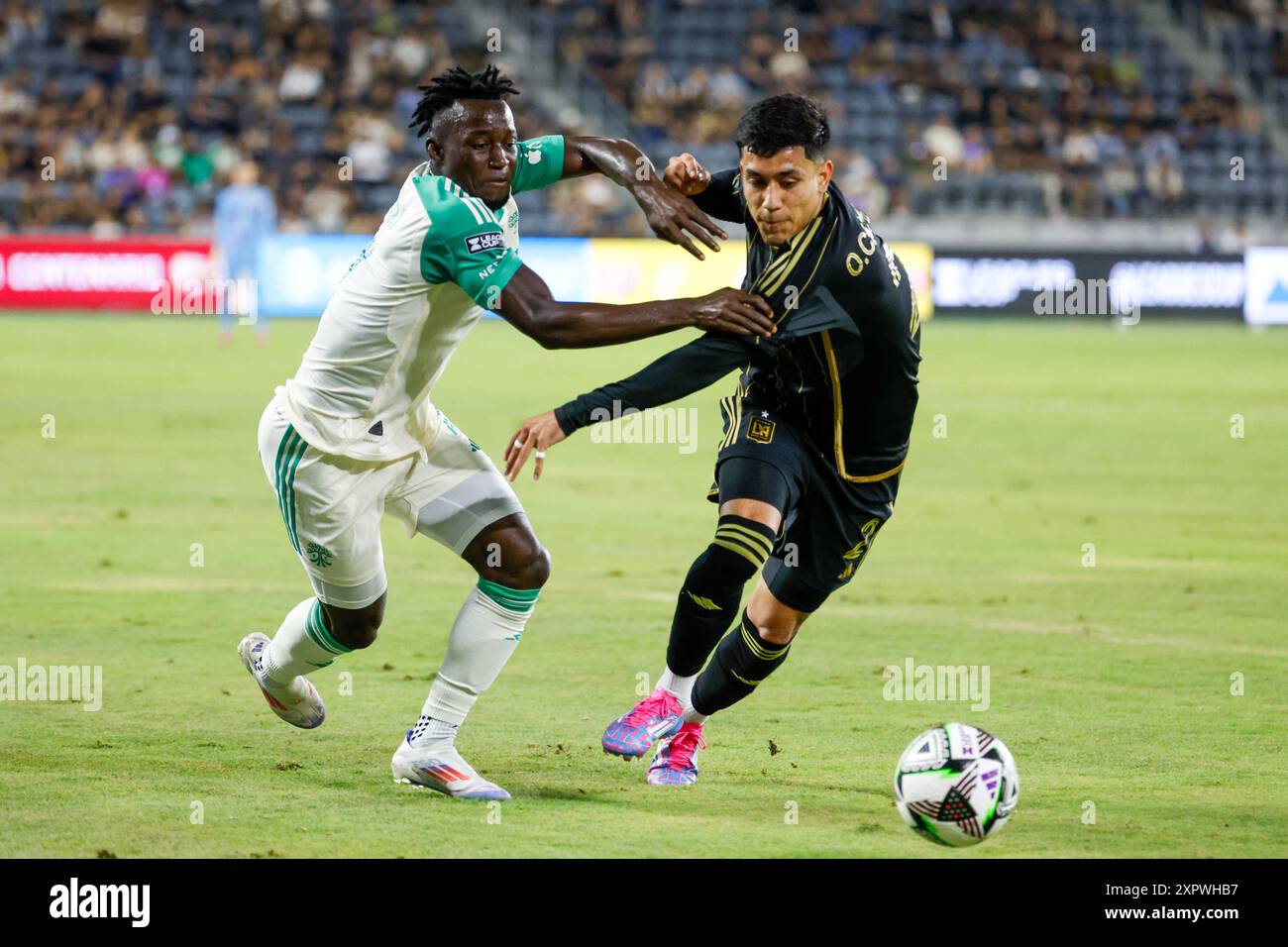 Los Angeles, United States. 07th Aug, 2024. Austin FC's Osman Bukari (L) and Los Angeles FC's Omar Campos (R) vie for the ball during a Leagues Cup match at BMO Stadium. Los Angeles FC won against Austin FC 2-0 (Photo by Ringo Chiu/SOPA Images/Sipa USA) Credit: Sipa USA/Alamy Live News Stock Photo