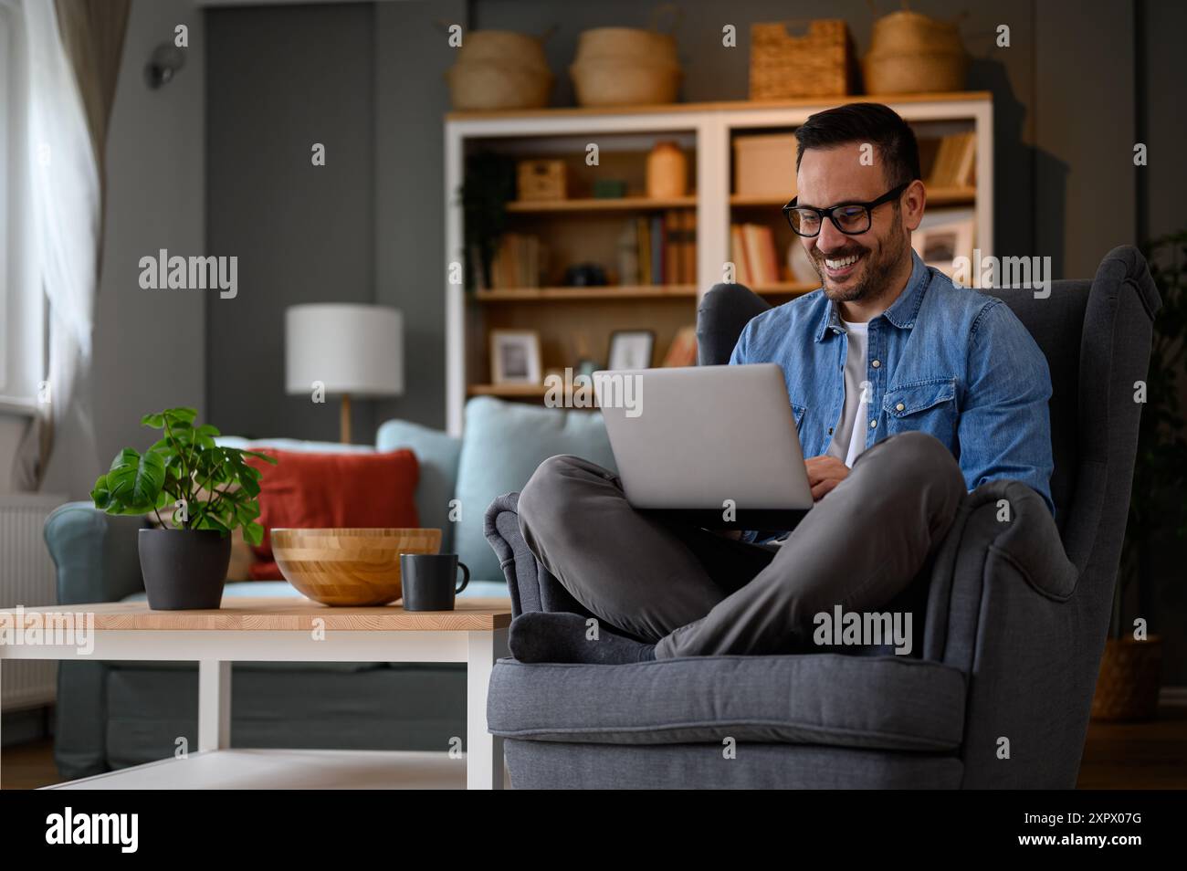 Man in denim shirt coding hi-res stock photography and images - Alamy