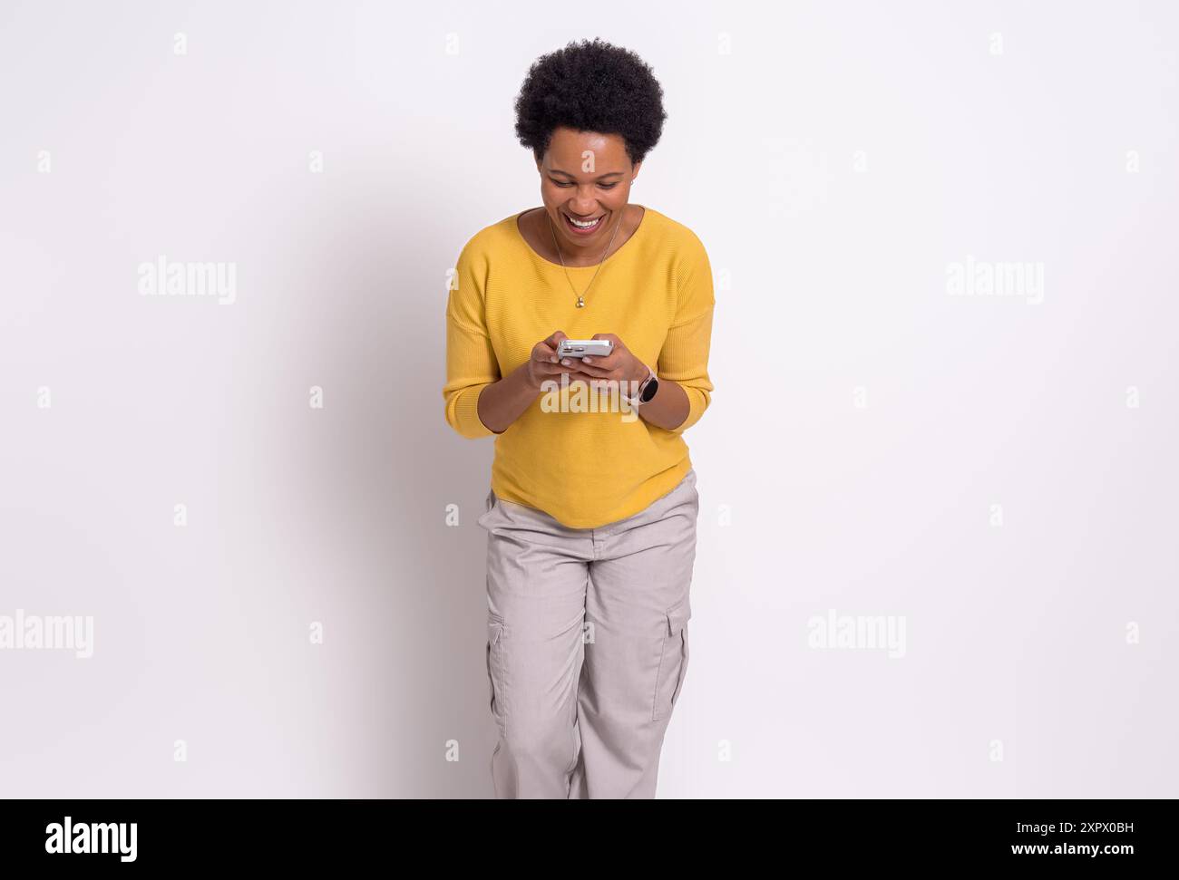 African woman typing messages on hi-res stock photography and images ...