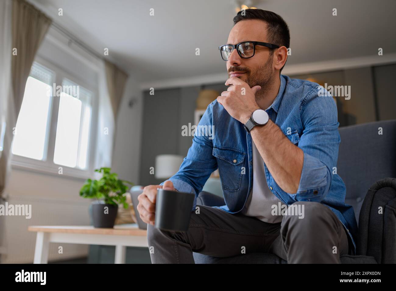 Person sitting comfortably cup hi-res stock photography and images - Alamy
