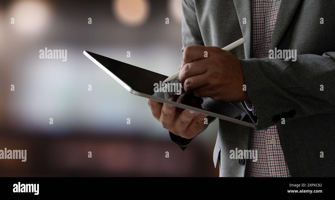 closeup man using his tablet touching screen device isolated screen ONLINE ADVERTISING Stock Photo