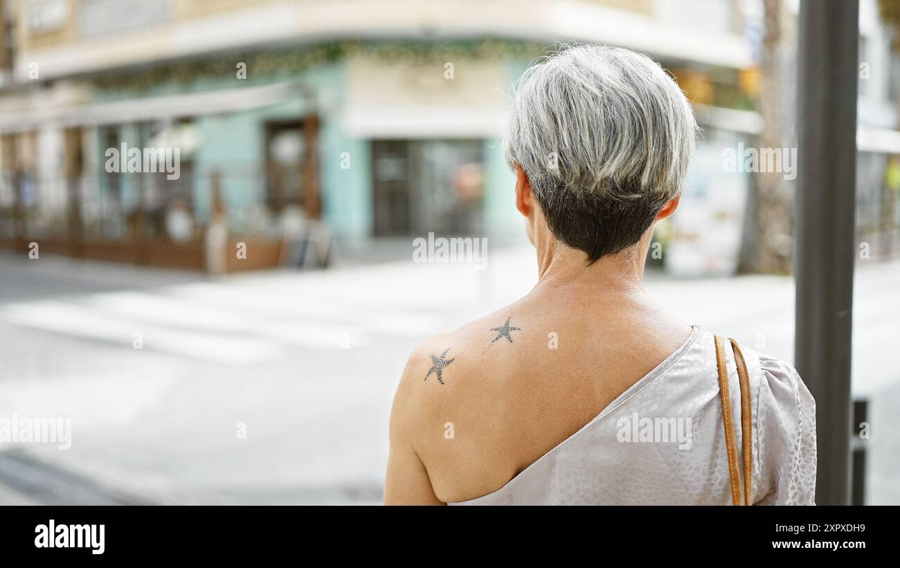 Mature woman tattoos grey hair hi-res stock photography and images - Alamy