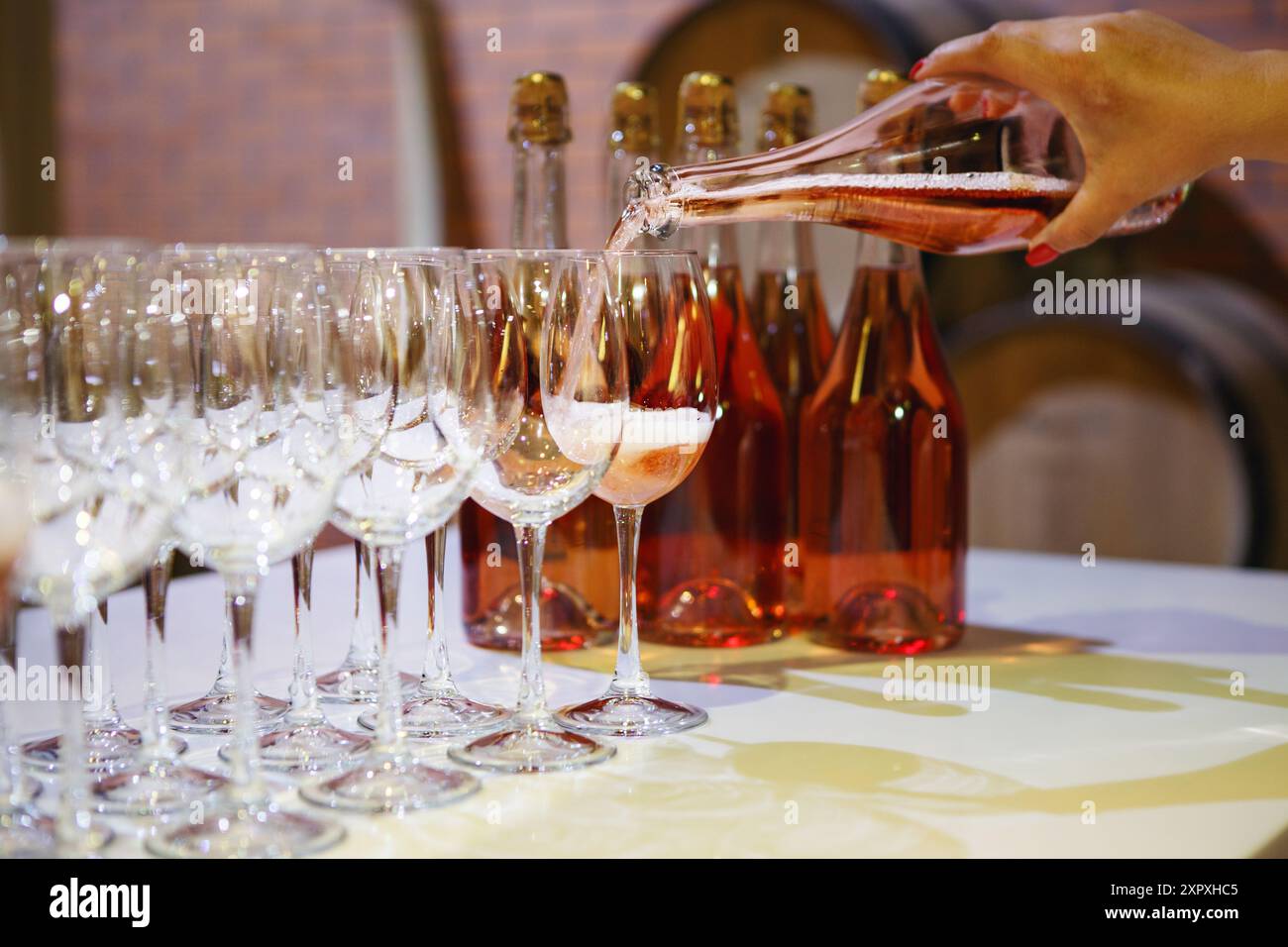 Springield Wines Pouring Sommelier hand pouring rose wine hi-res stock photography and images ...