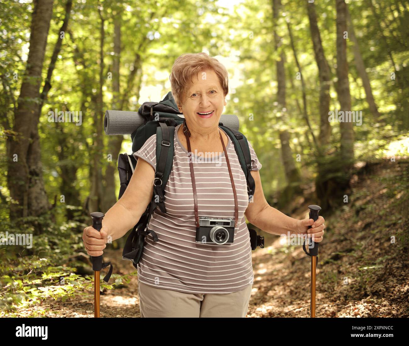 Mature backpacker trekking poles hi-res stock photography and images ...
