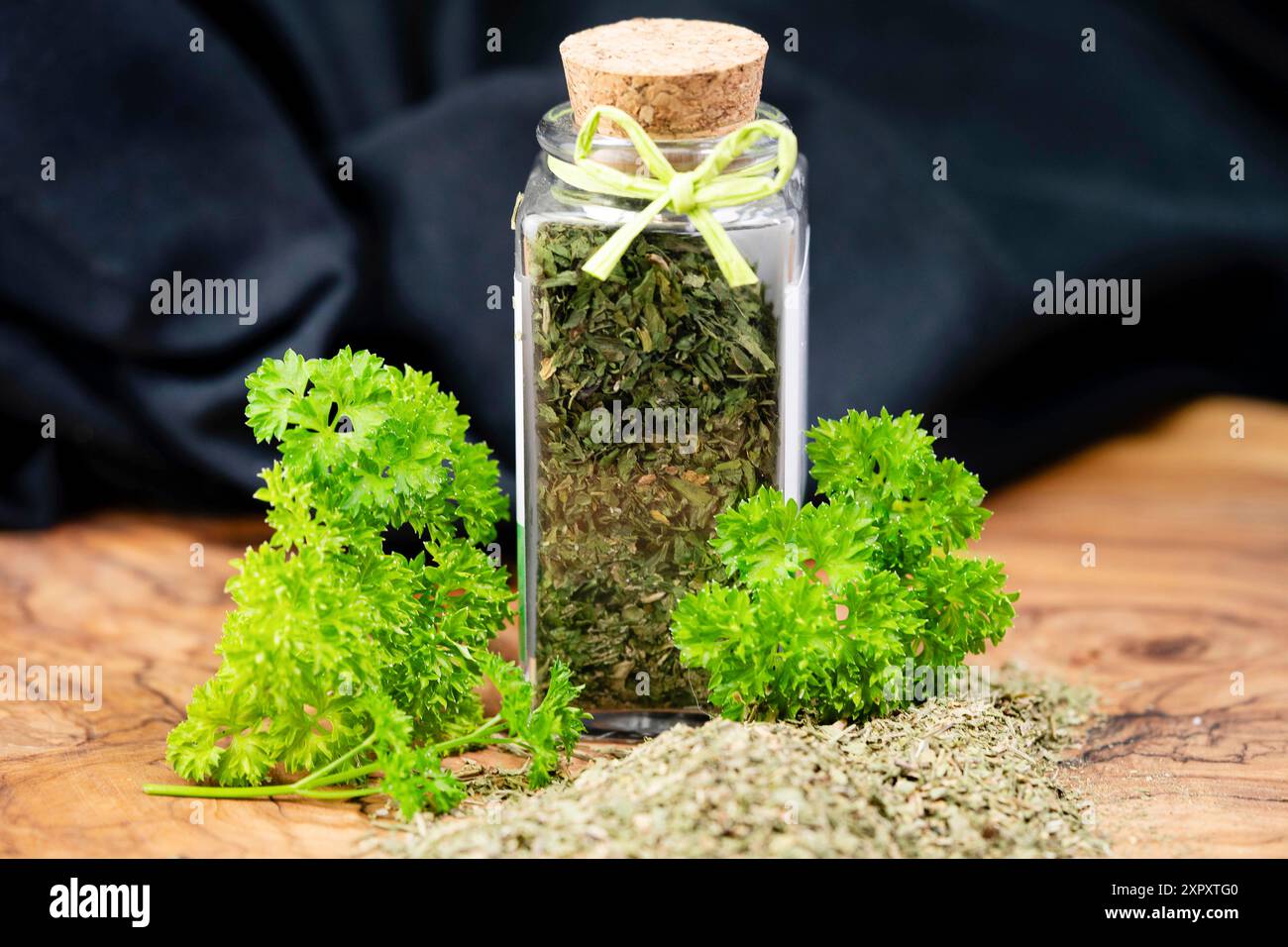 Curley leaf parsley, Parsley (Petroselinum crispum), fresh leaves and rubbed in a glass Stock Photo