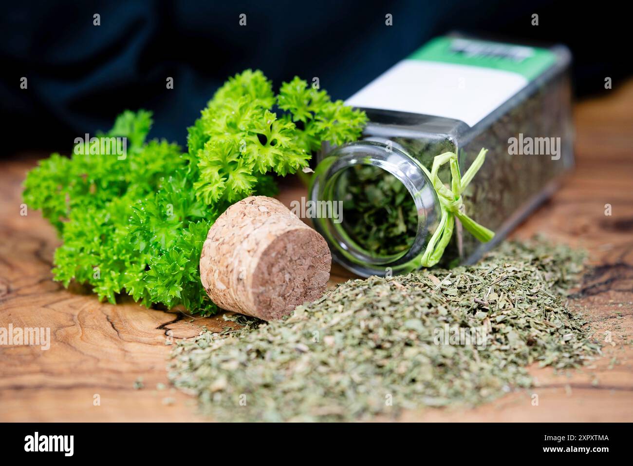 Curley leaf parsley, Parsley (Petroselinum crispum), fresh leaves and rubbed in a glass Stock Photo