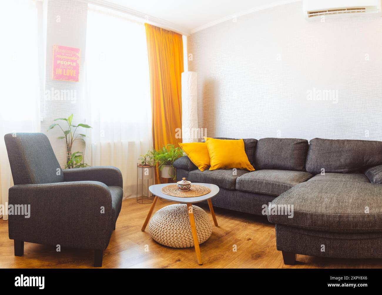 Cozy apartment living room with sofa and yellow pillows and stylish ...