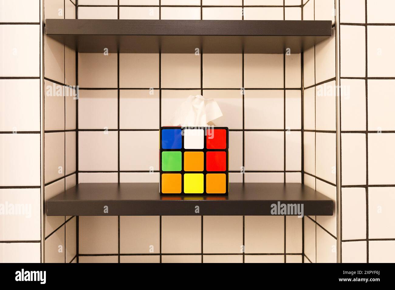 rubik's cube shaped towel holder in bathroom Stock Photo