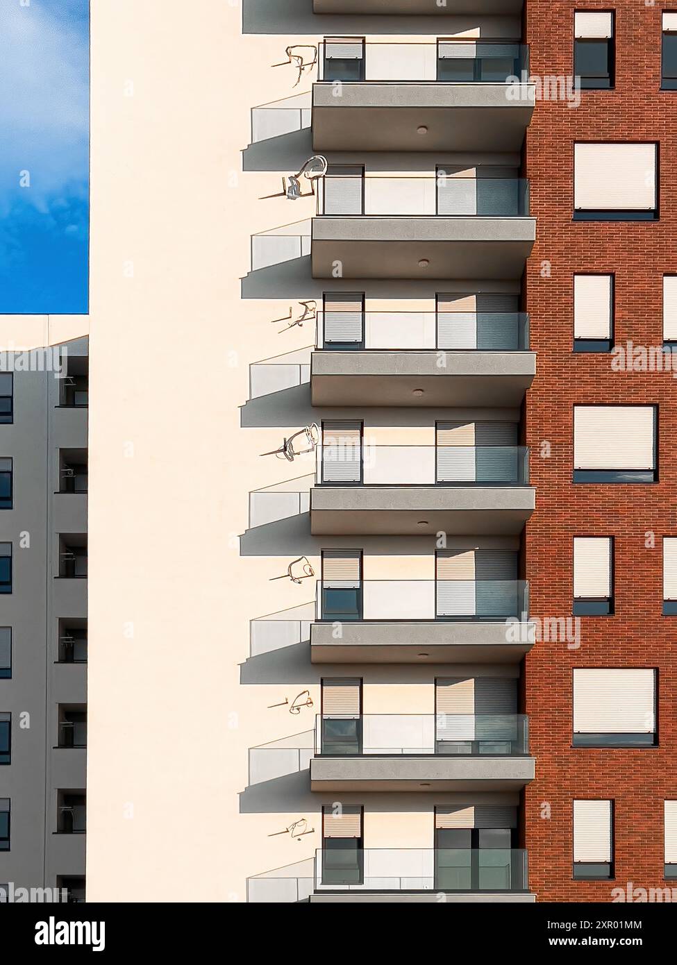 Modern new residential skyscraper building against blue sky, architectural patterns and background Stock Photo