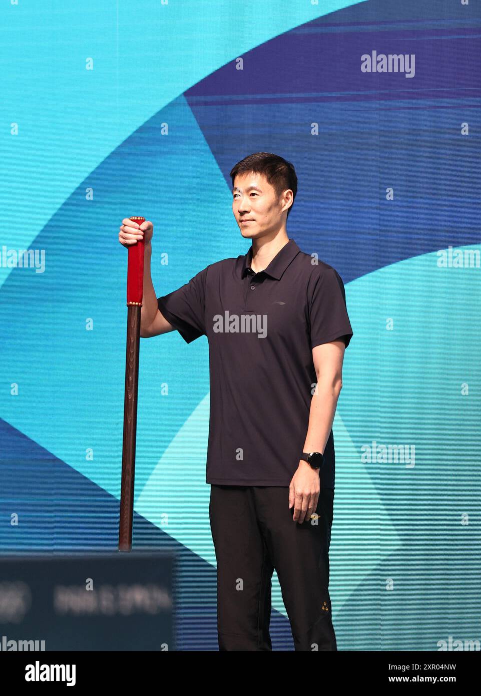 Paris, France. 8th Aug, 2024. China's former table tennis Olympic champion Wang Liqin is seen before the men's team semifinal of table tennis between China and France at the Paris 2024 Olympic Games in Paris, France, on Aug. 8, 2024. Credit: Wang Dongzhen/Xinhua/Alamy Live News Stock Photo