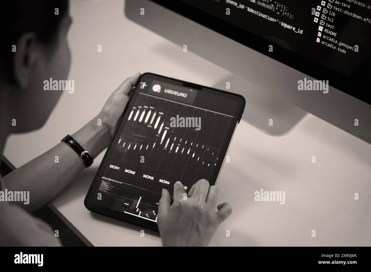 Analyzing Financial Data on Modern Tablet Device Stock Photo
