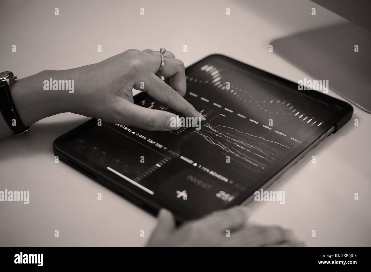Analyzing Financial Data on Digital Tablet Device Stock Photo