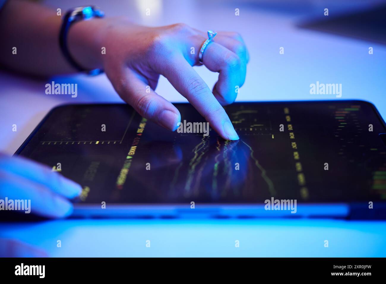 Analyzing Financial Data on Digital Tablet Stock Photo