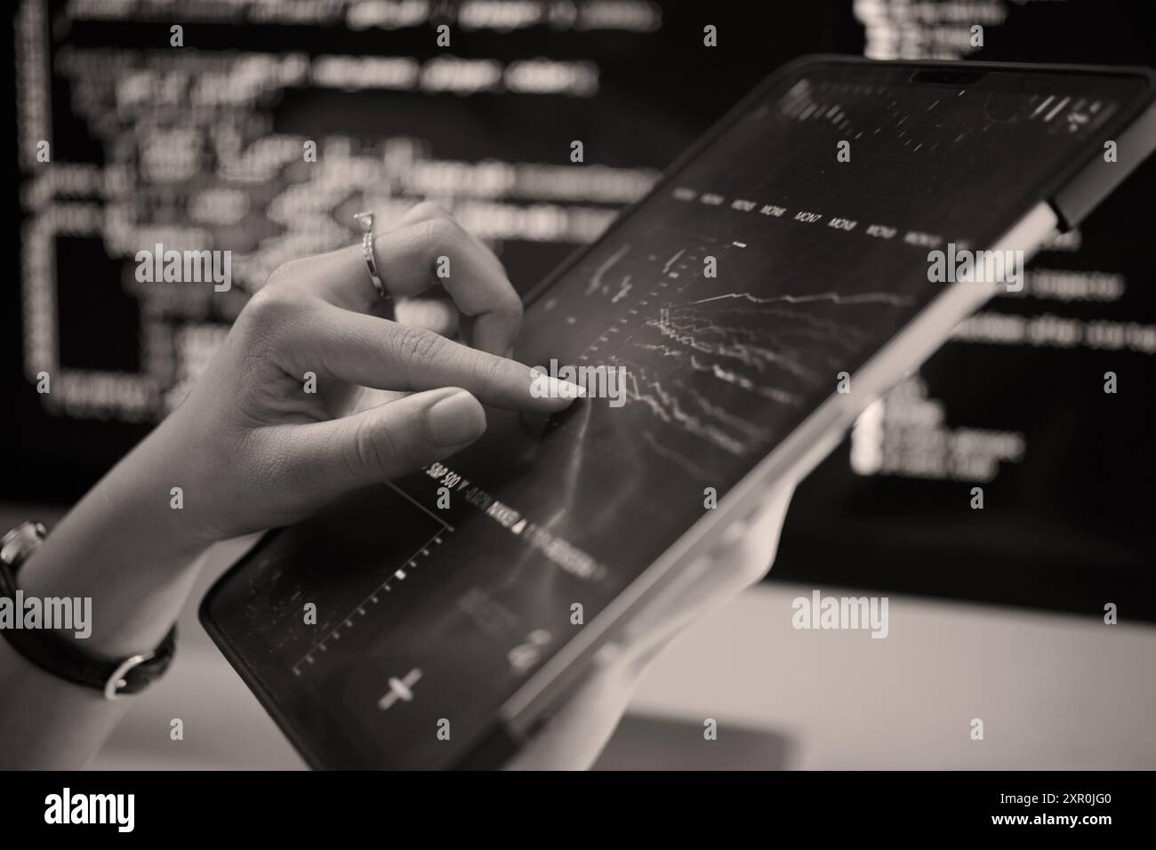 Analyzing Data on Tablet Using High-Tech Tools Stock Photo