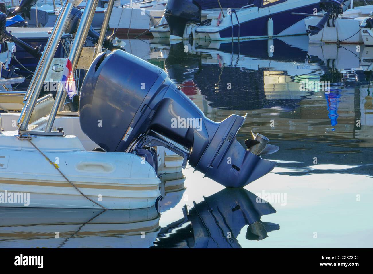 Outboard engine on the plastic boat Stock Photo