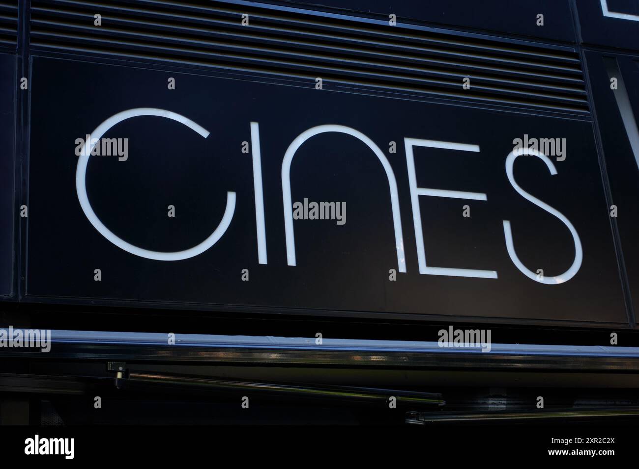 Cinema sign on a façade to indicate in Spanish an establishment where ...