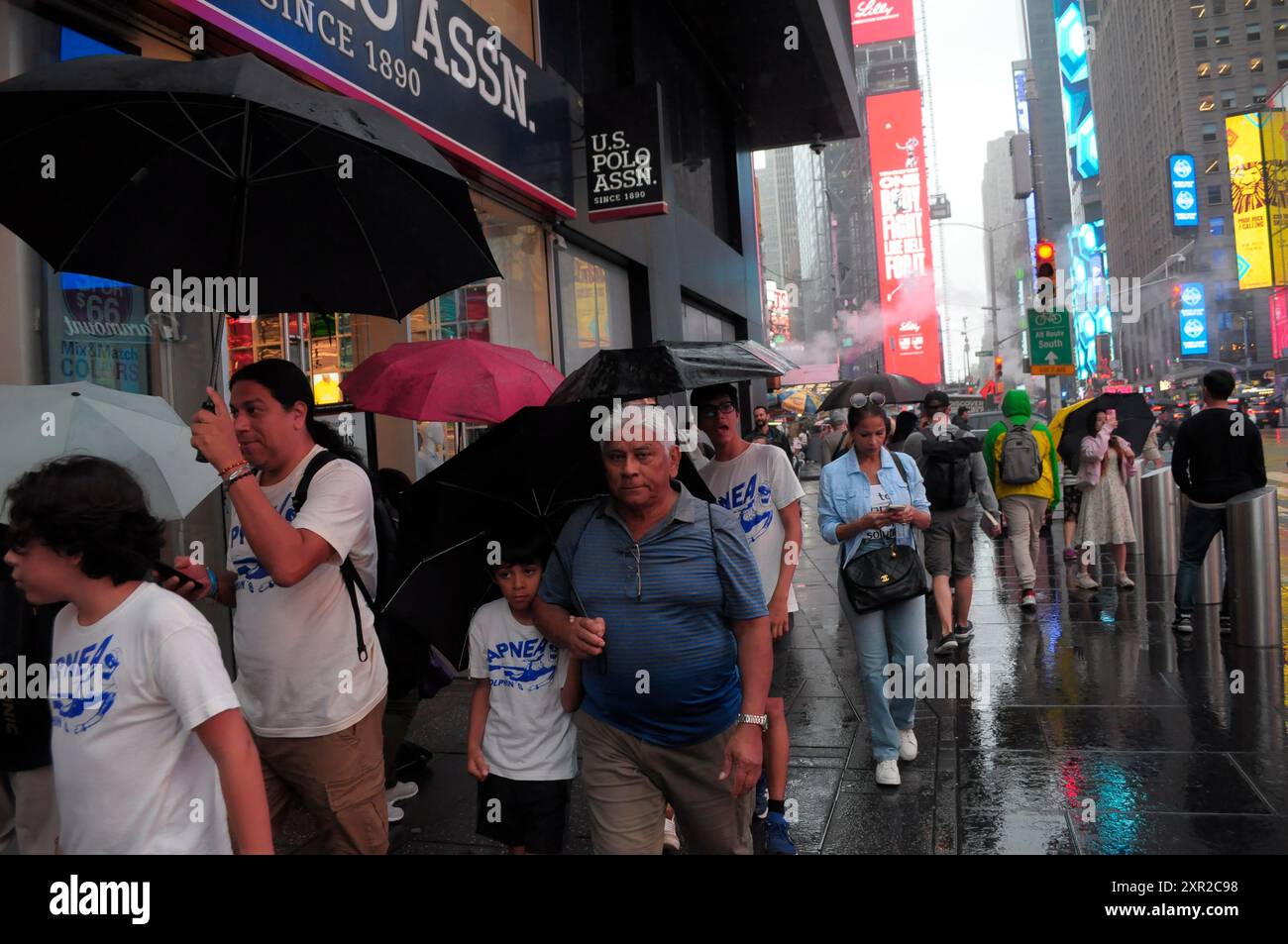 People Are Seen Walking In The Rain In Times Square Manhattan New