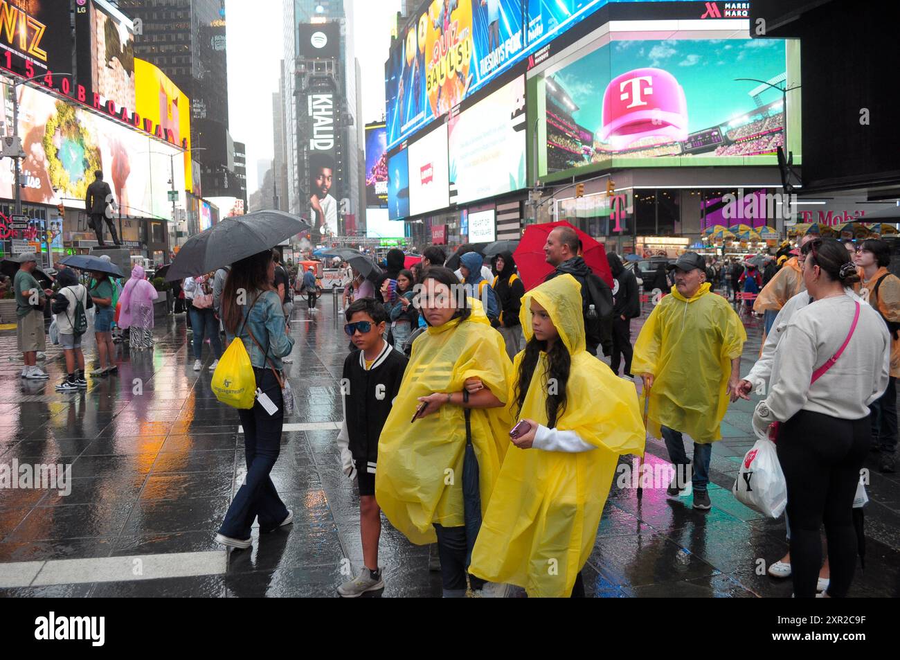 People Are Seen Walking In The Rain In Times Square Manhattan New