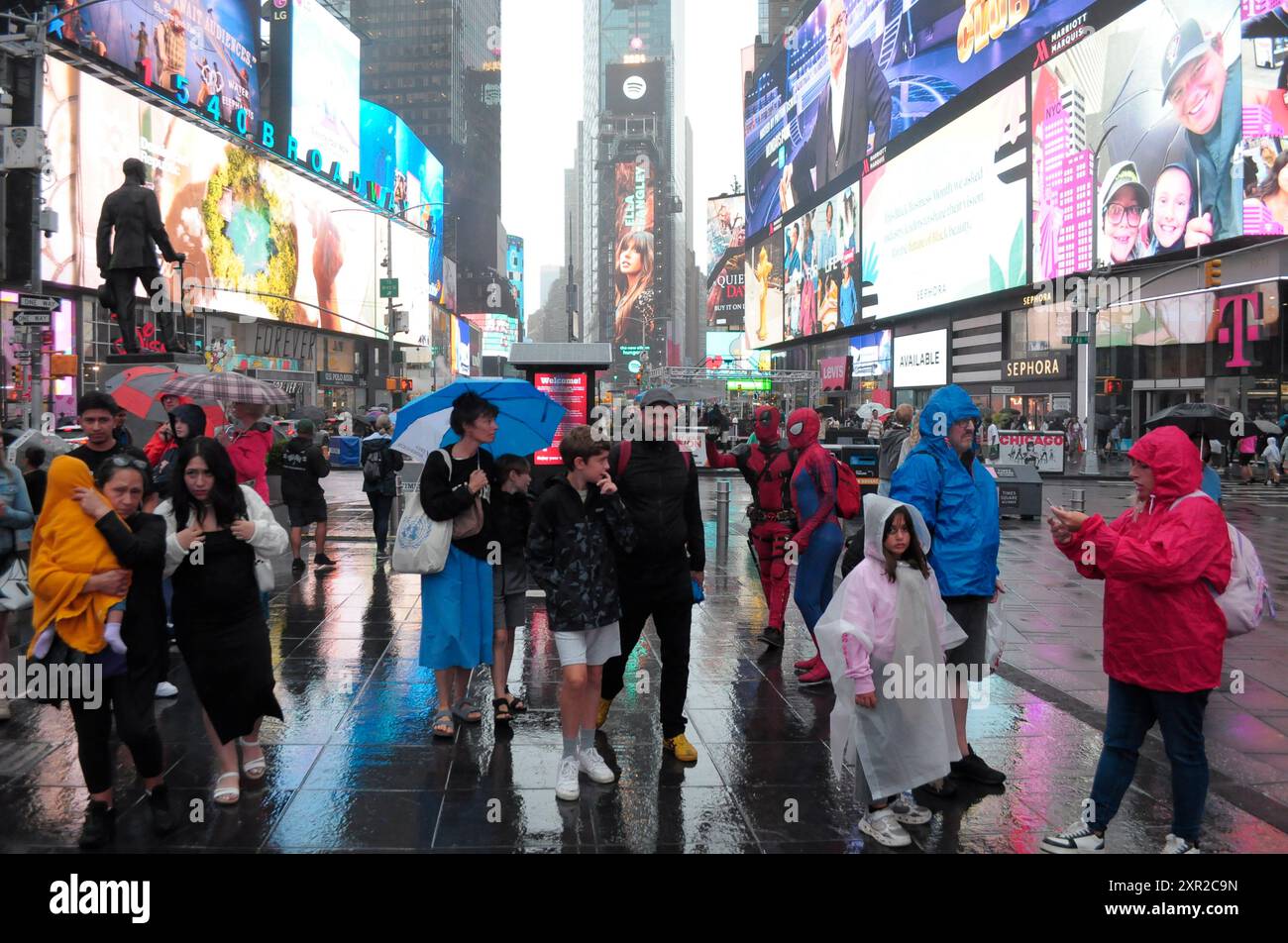 People Are Seen Walking In The Rain In Times Square Manhattan New