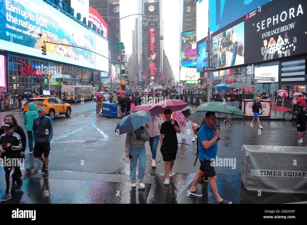 People Are Seen Walking In The Rain In Times Square Manhattan New
