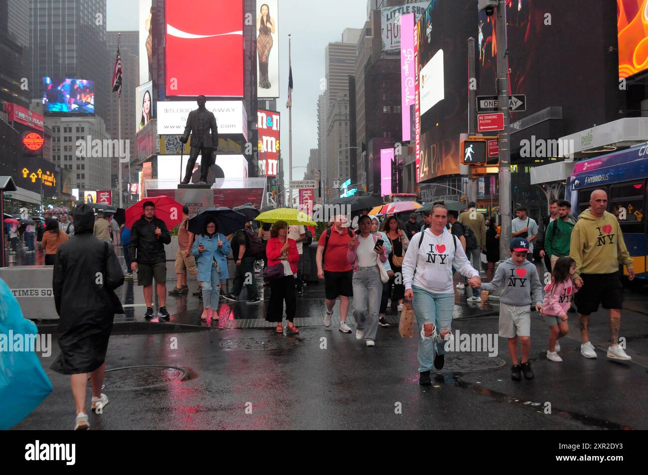 People Are Seen Walking In The Rain In Times Square Manhattan New