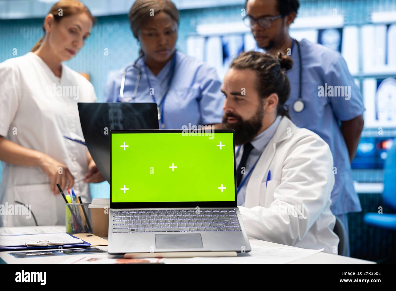 Diverse medical team examining test hi-res stock photography and images ...