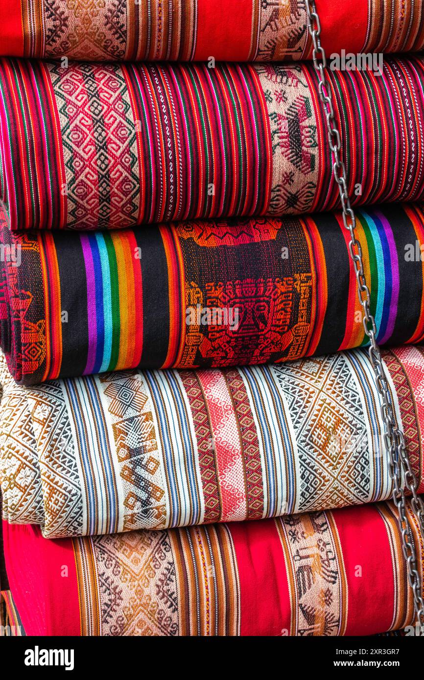 Close-up of traditional Andean woven fabrics with geometric patterns in ...