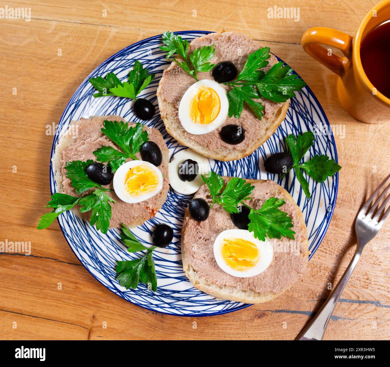 Sandwiches with pollock liver and roe pate, egg, olives Stock Photo - Alamy