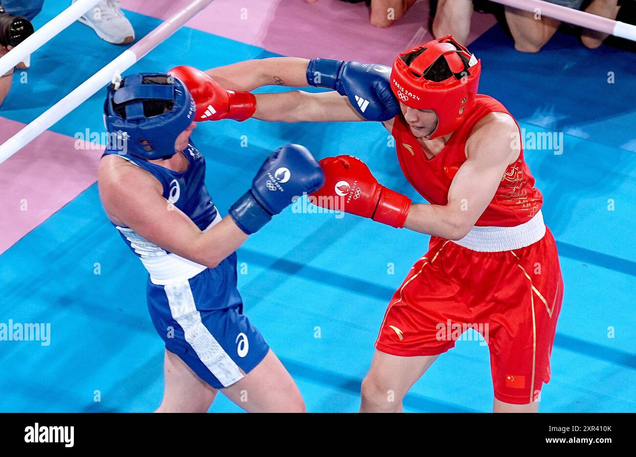 Li Quan Boxing Paris, France. 8th Aug, 2024. Li Qian (in red) of China competes ...