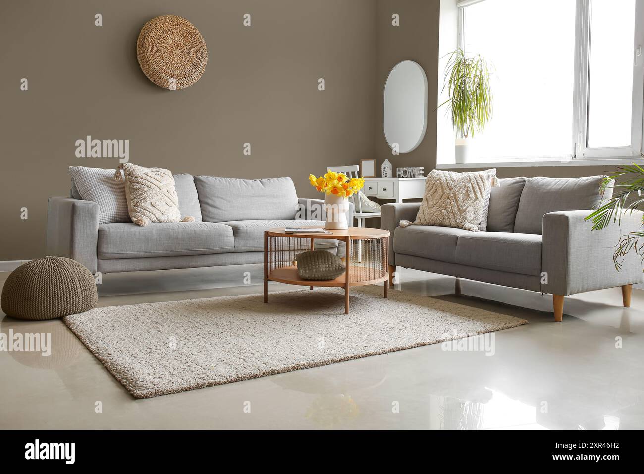 Interior of modern living room with cozy sofas and table Stock Photo ...