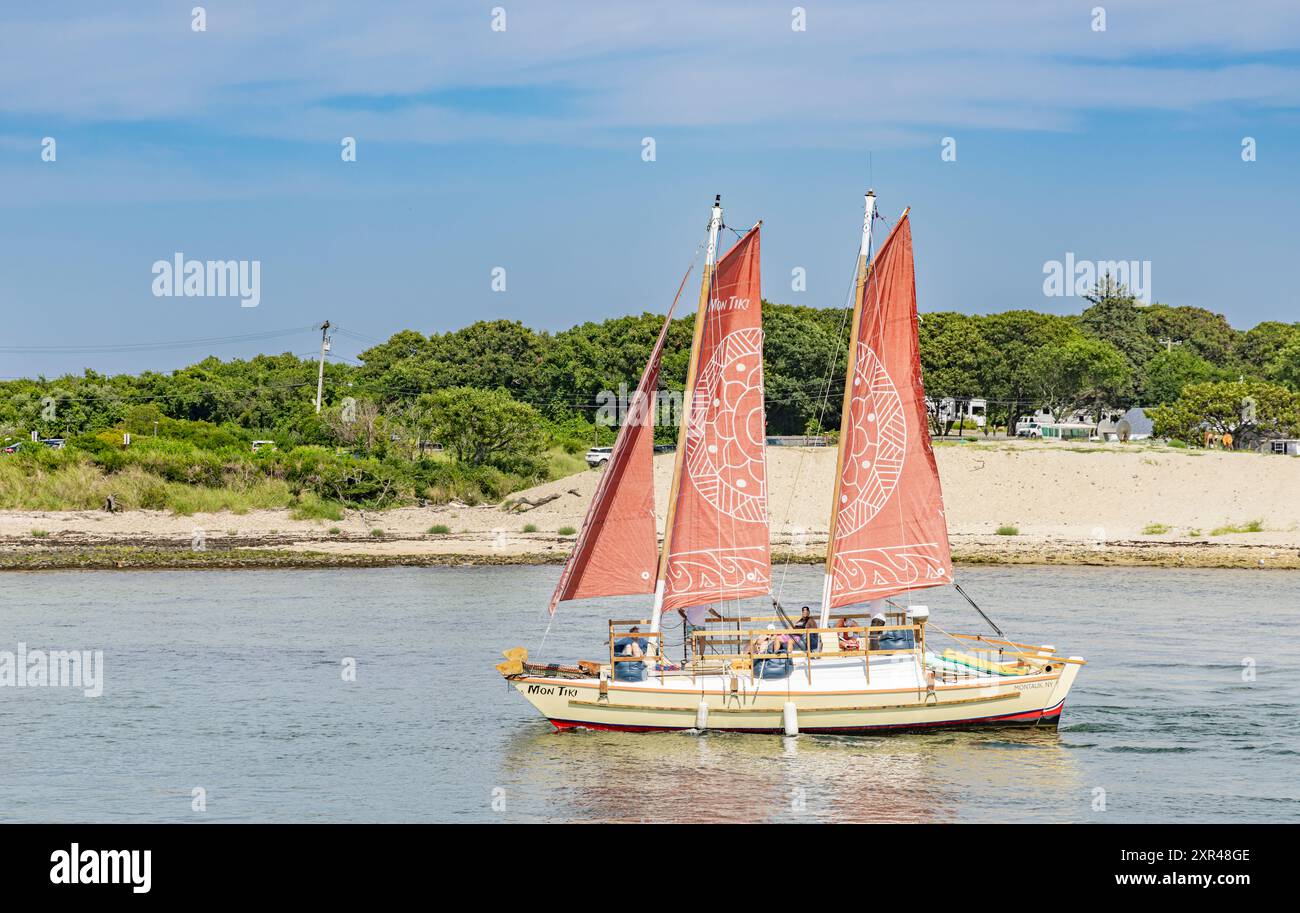 Catamaran mon tiki leaving montauk harbor Stock Photo