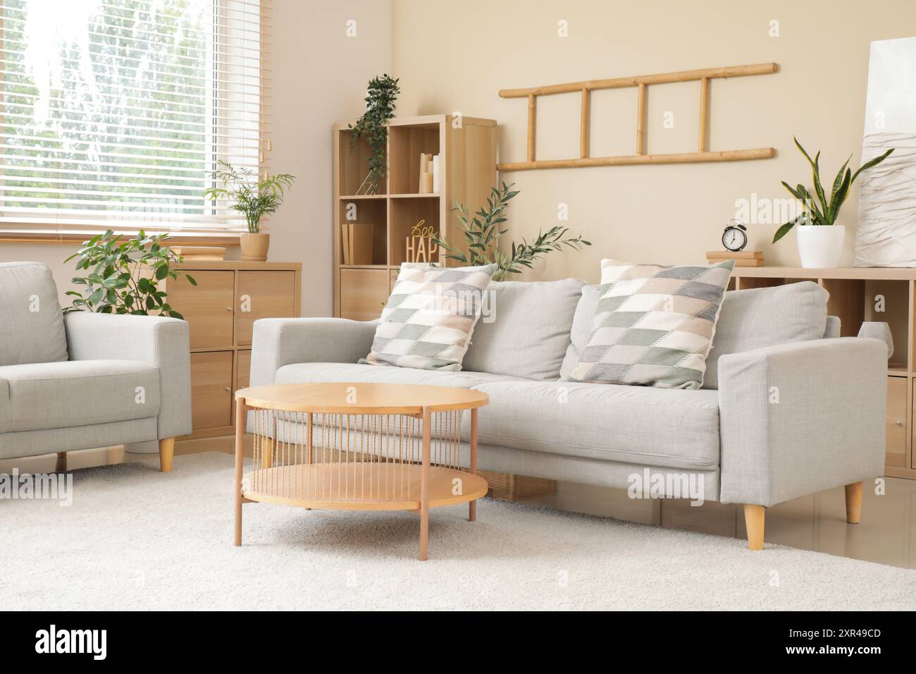 Stylish interior of living room with grey sofas and coffee table Stock ...