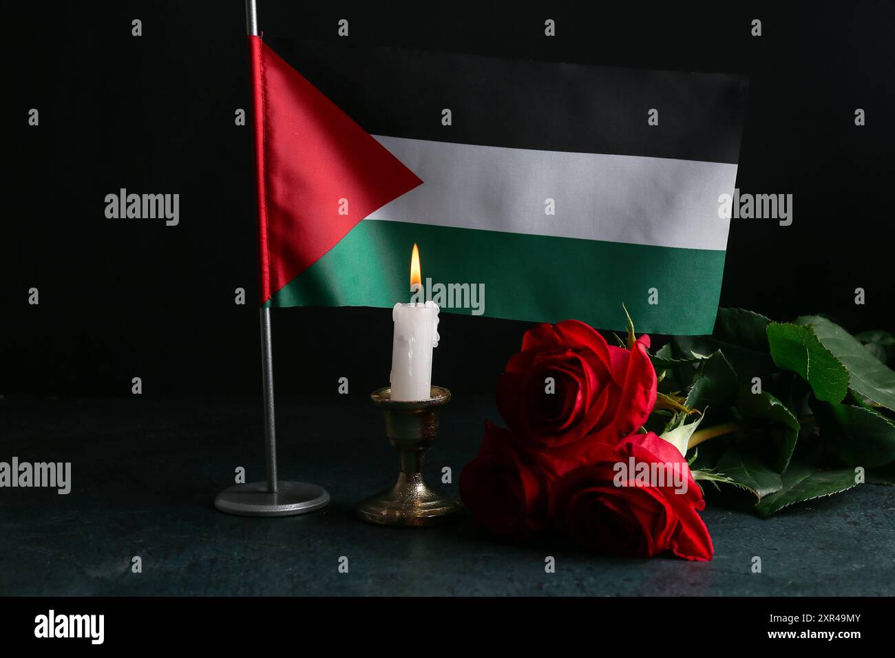 Palestinian Roses Flag of Palestine with burning candle and red roses on black background ...