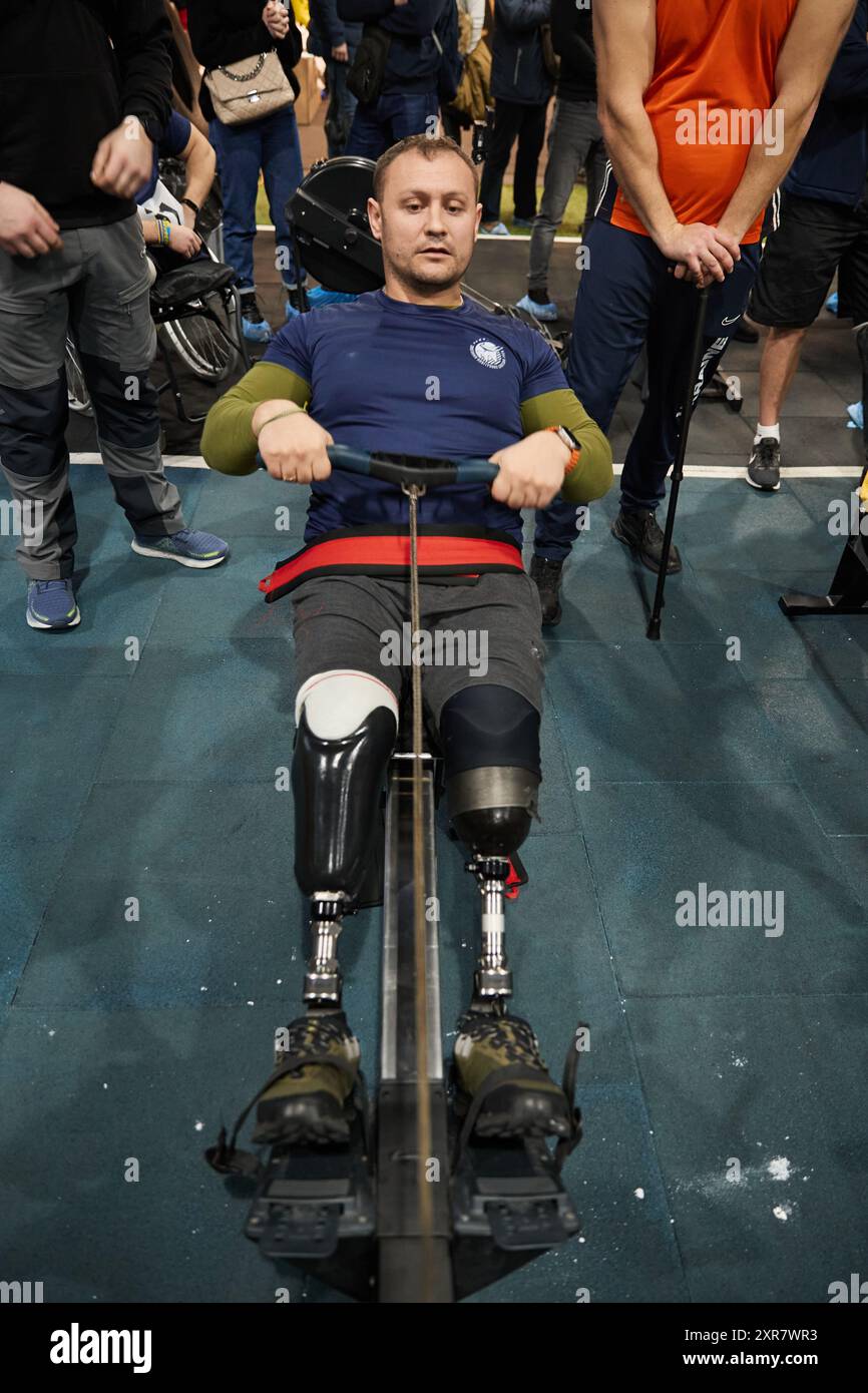 Ukrainian veteran with amputated legs rowing on a machine. Kyiv - 13 ...