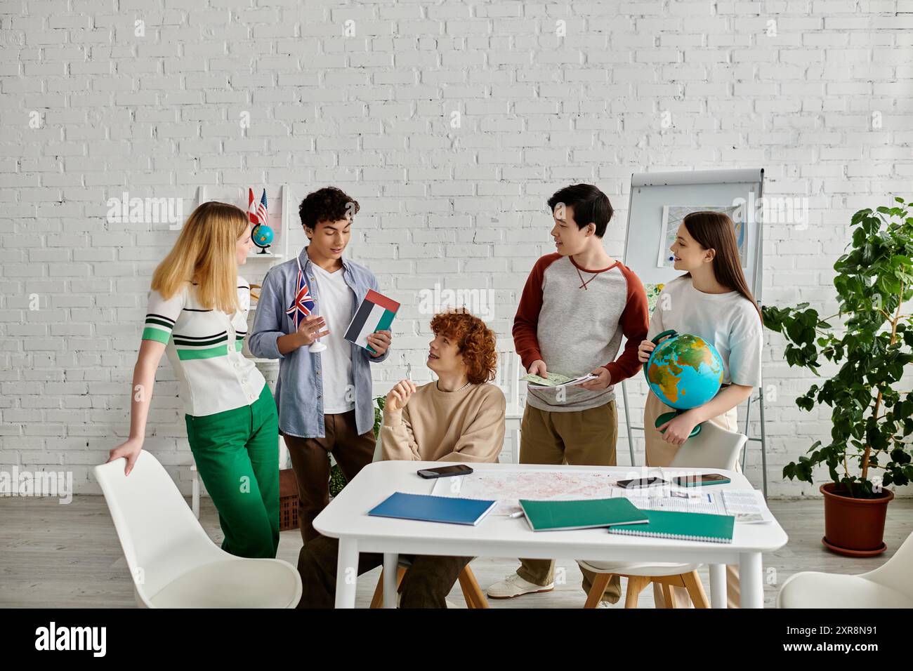 Teens simulate UN Model discussing global issues with flags Stock Photo ...