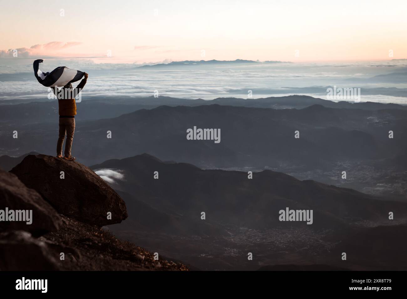Hiker atop mountain hi-res stock photography and images - Alamy