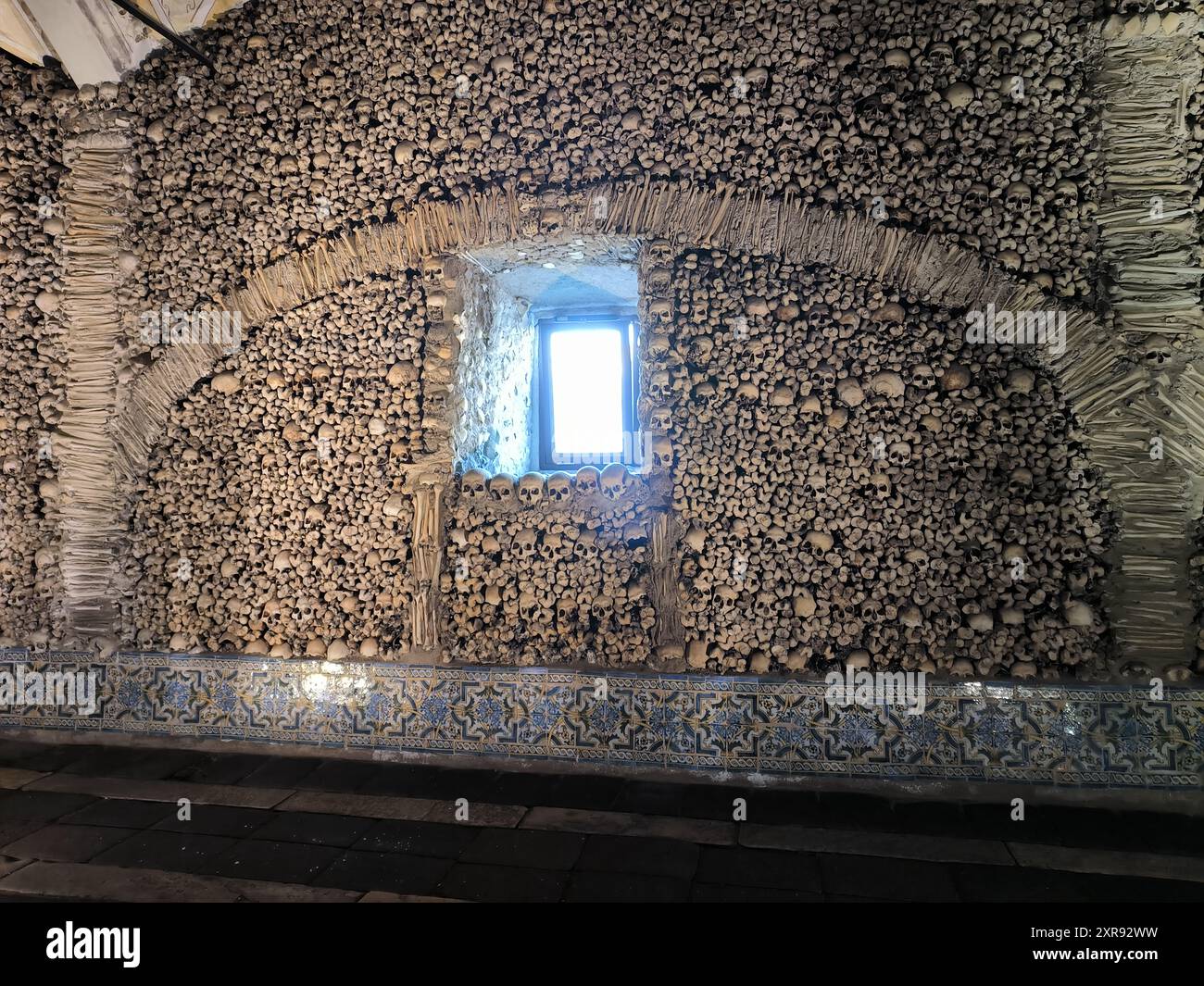 Wall of human bones catacombs, Évora, Portugal Stock Photo - Alamy