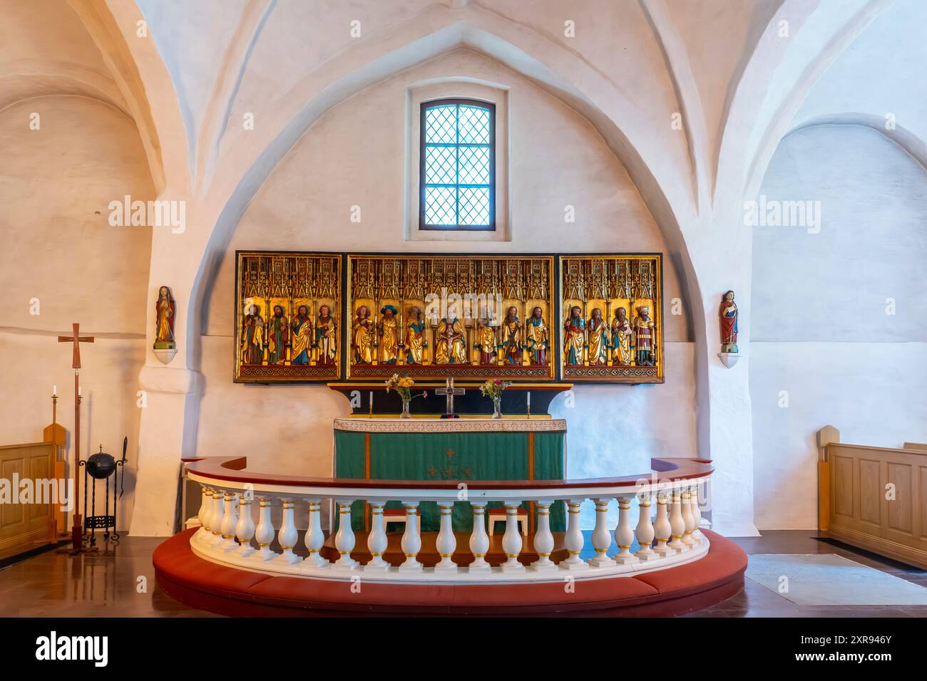 The triptych altarpiece in Drothems church, Söderköping, Östergötland. Sweden. The triptych was made by a northern German woodcarver Stock Photo