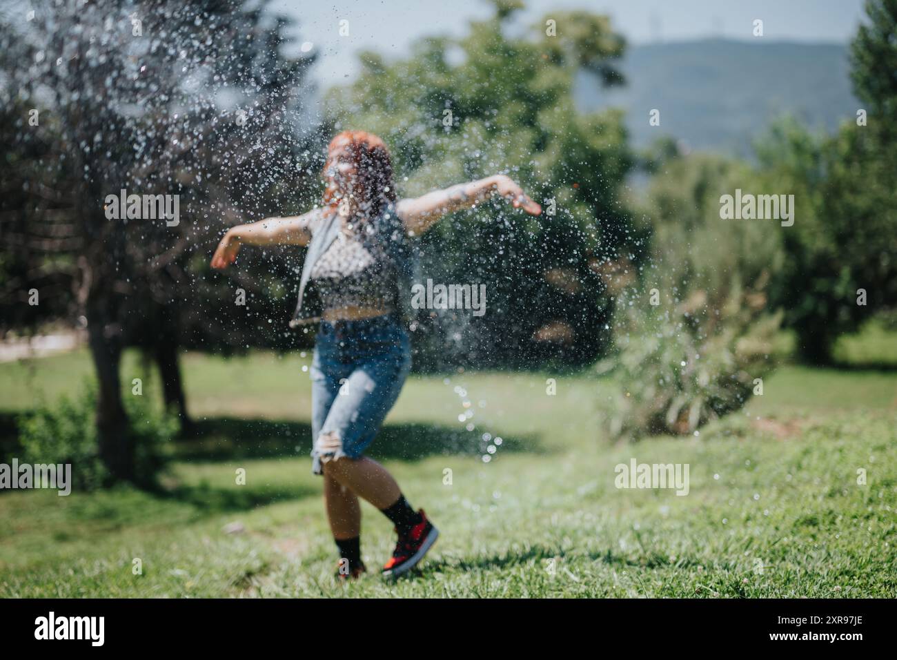 Young woman dancing fountain hi-res stock photography and images - Alamy