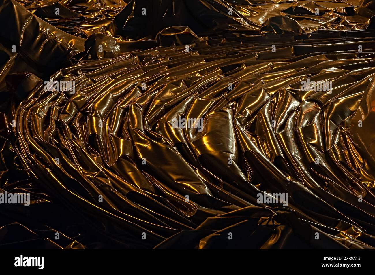 Plastic material being highlighted by yellow lamps Stock Photo