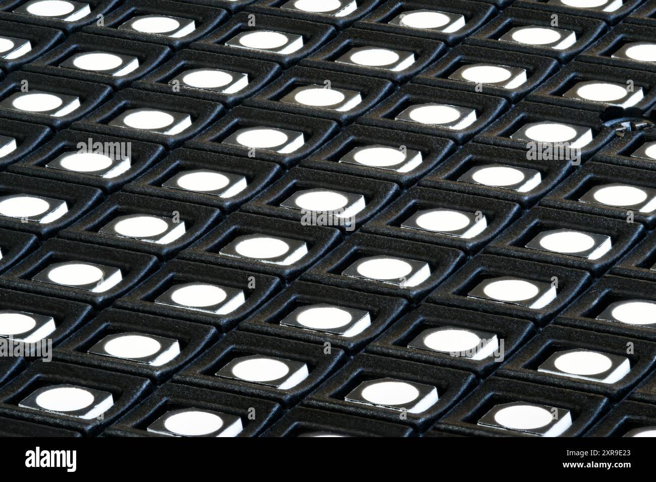 Diagonal macro shot of the surface of an LED screen module with rows of LEDs. Stock Photo