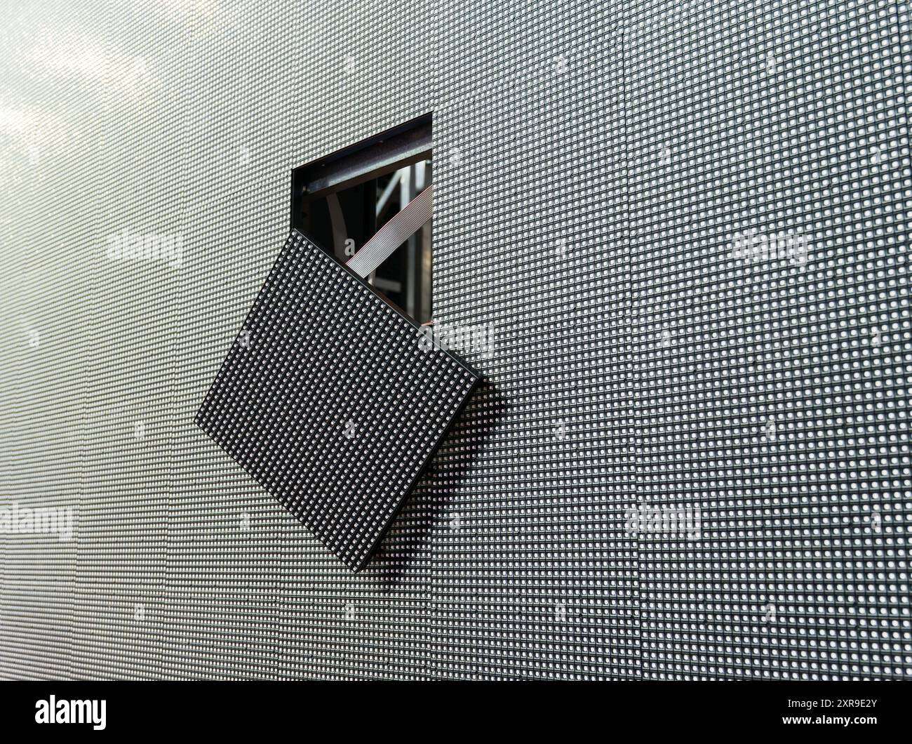 The LED module has fallen out of its place on the surface of the large LED screen. Stock Photo