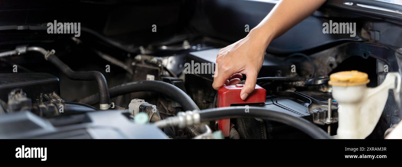 Asian driver woman checking car radiator problems on the road, office female checks break down vehicle engine. Travel problems waste time, pickup truc Stock Photo