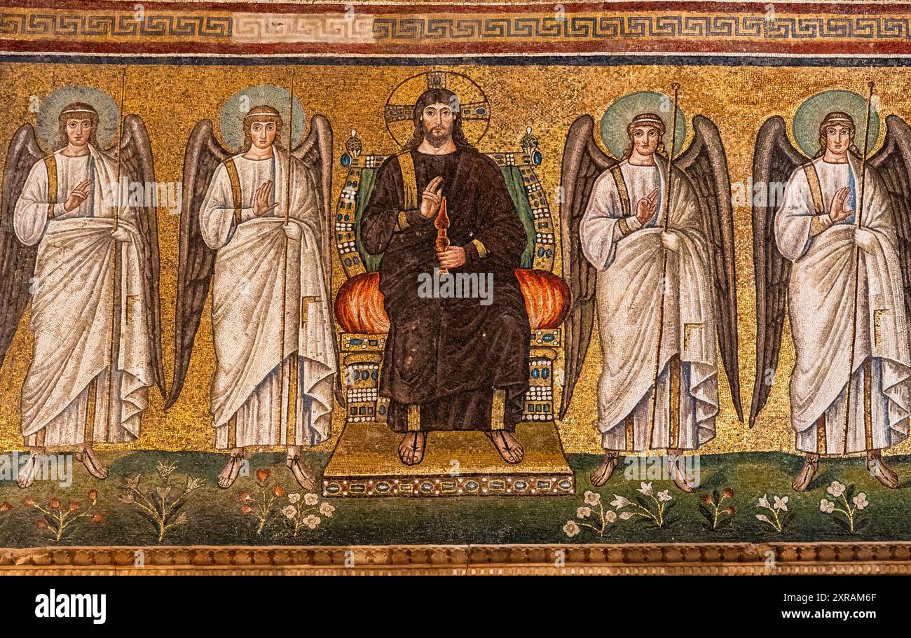 Close-up on medieval wall mosaic showing Jesus Christ on a throne surrounded by standing angels Stock Photo