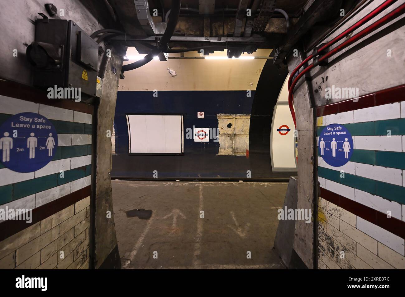 Social distancing signs on a disused platform at Holborn tube station Stock Photo