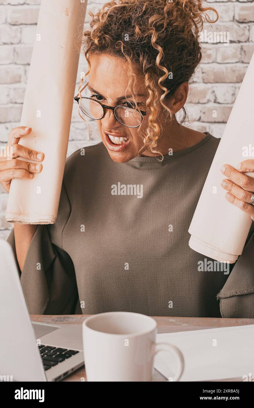 Angry woman in front a computer with bad and stressed expression 