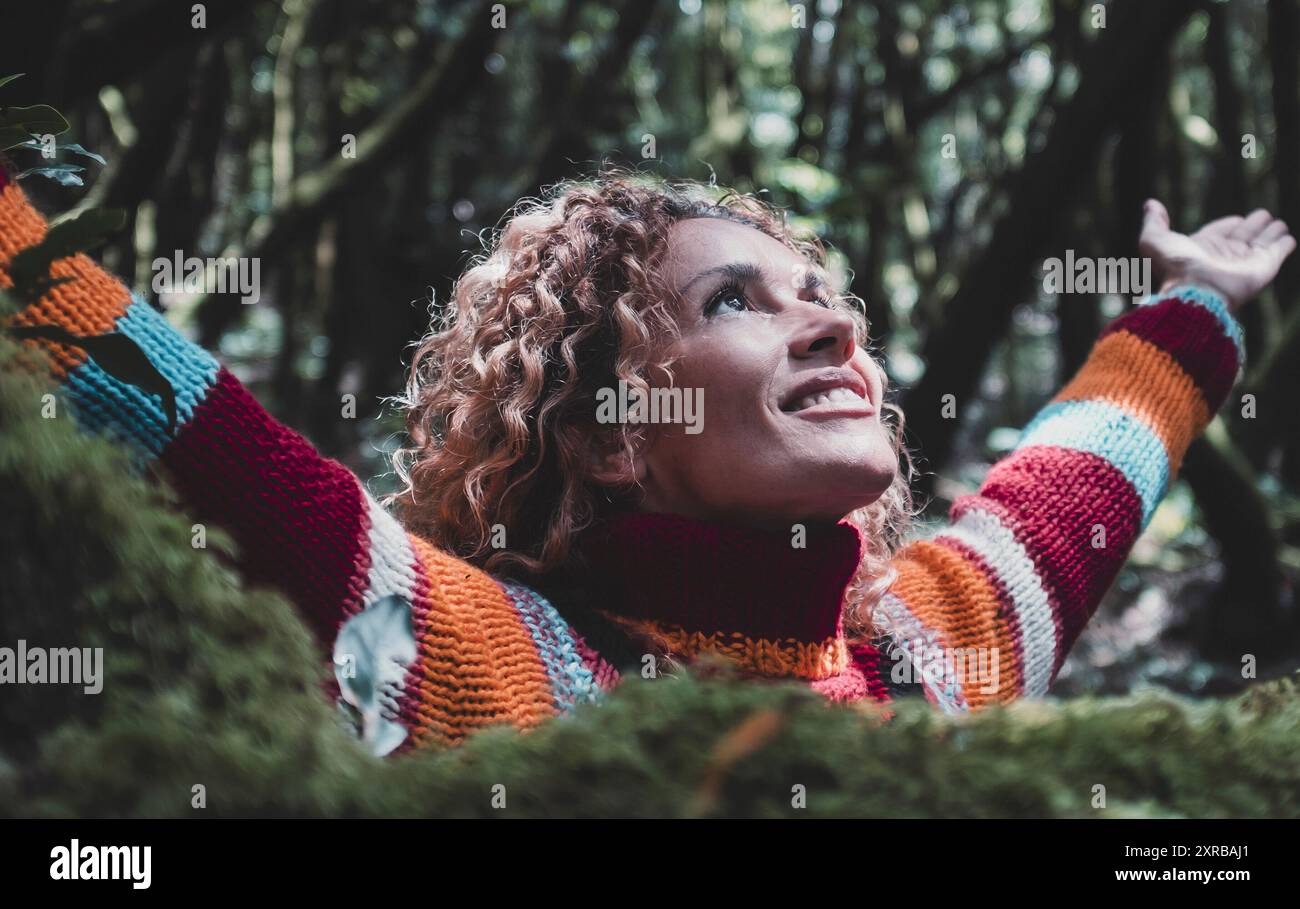 Profile of a relaxed woman breathing fresh air in a green forest ...